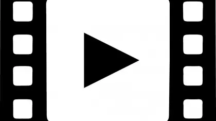 Black and white picture of film strips with a play symbol in the middle